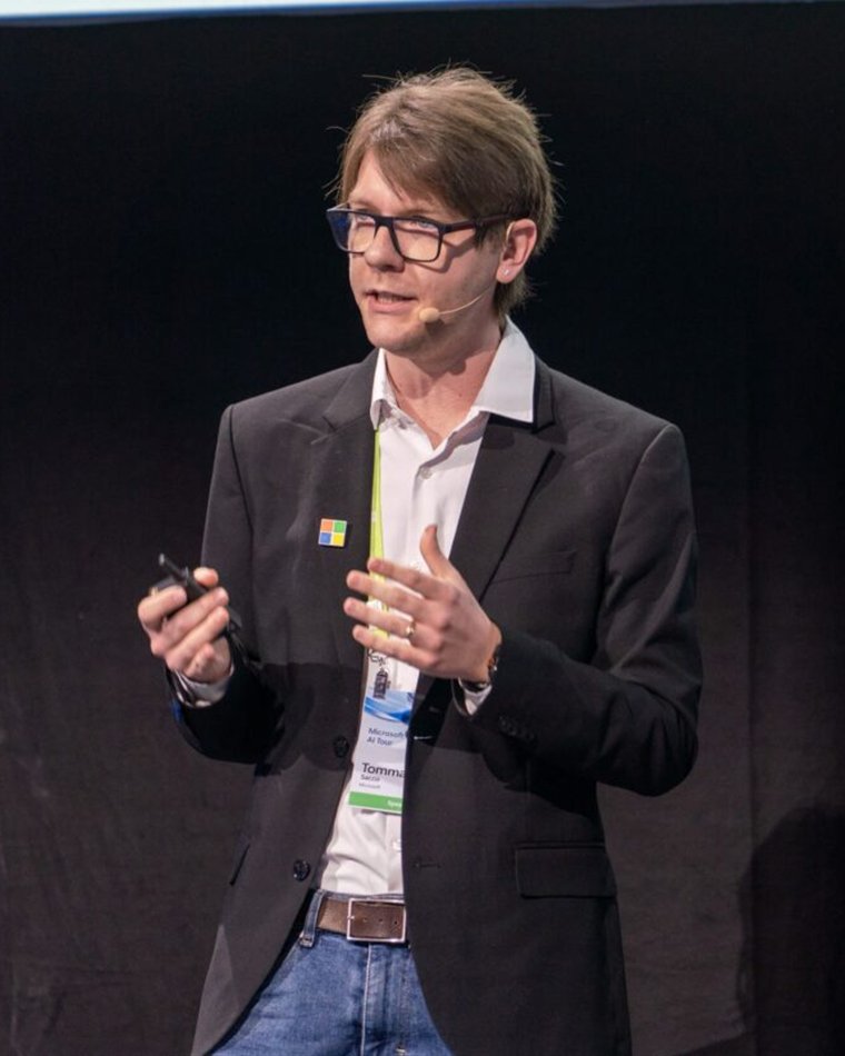 Tommaso Sacco speaking on stage at a Microsoft event